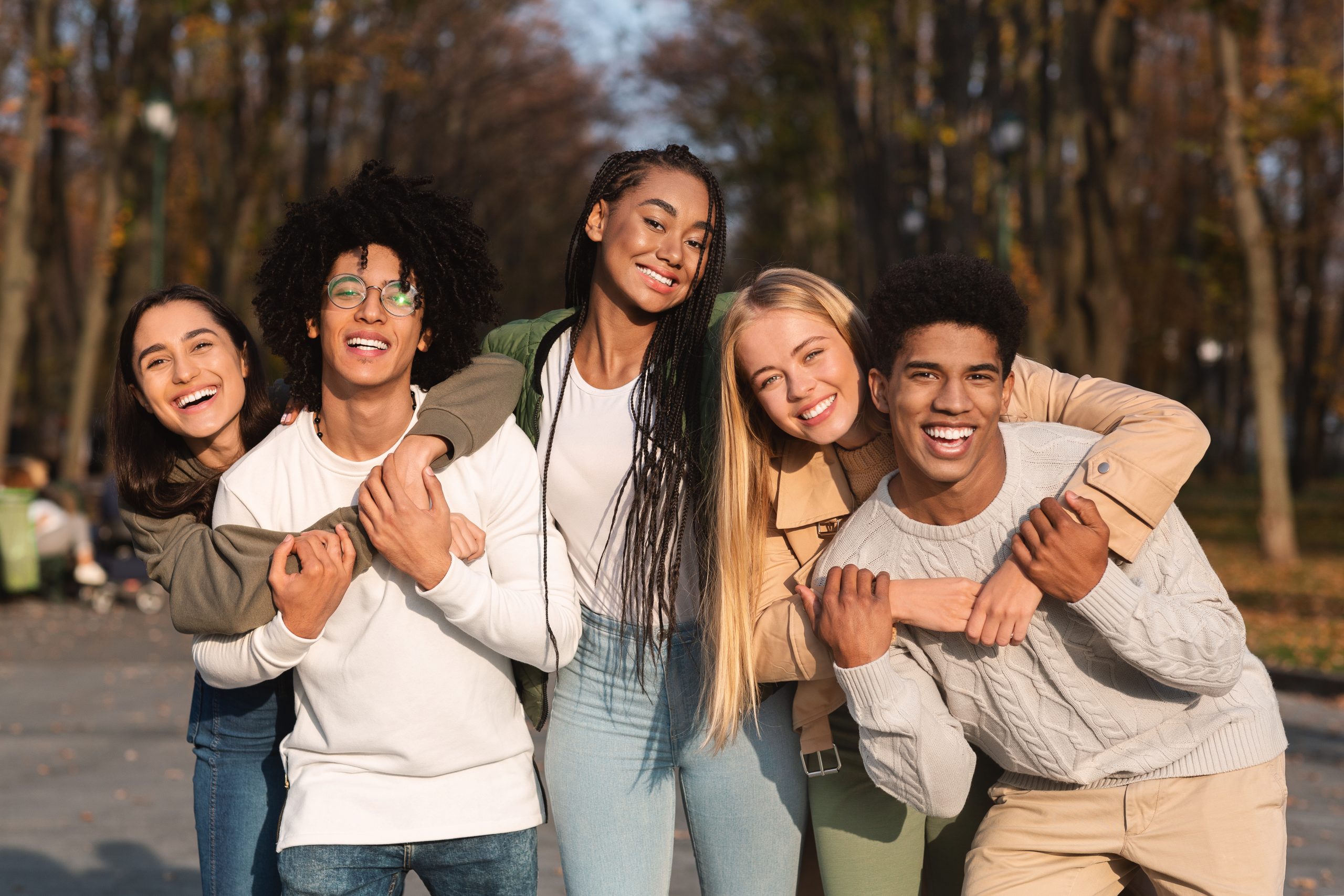 Group of smiling teenagers and young adults