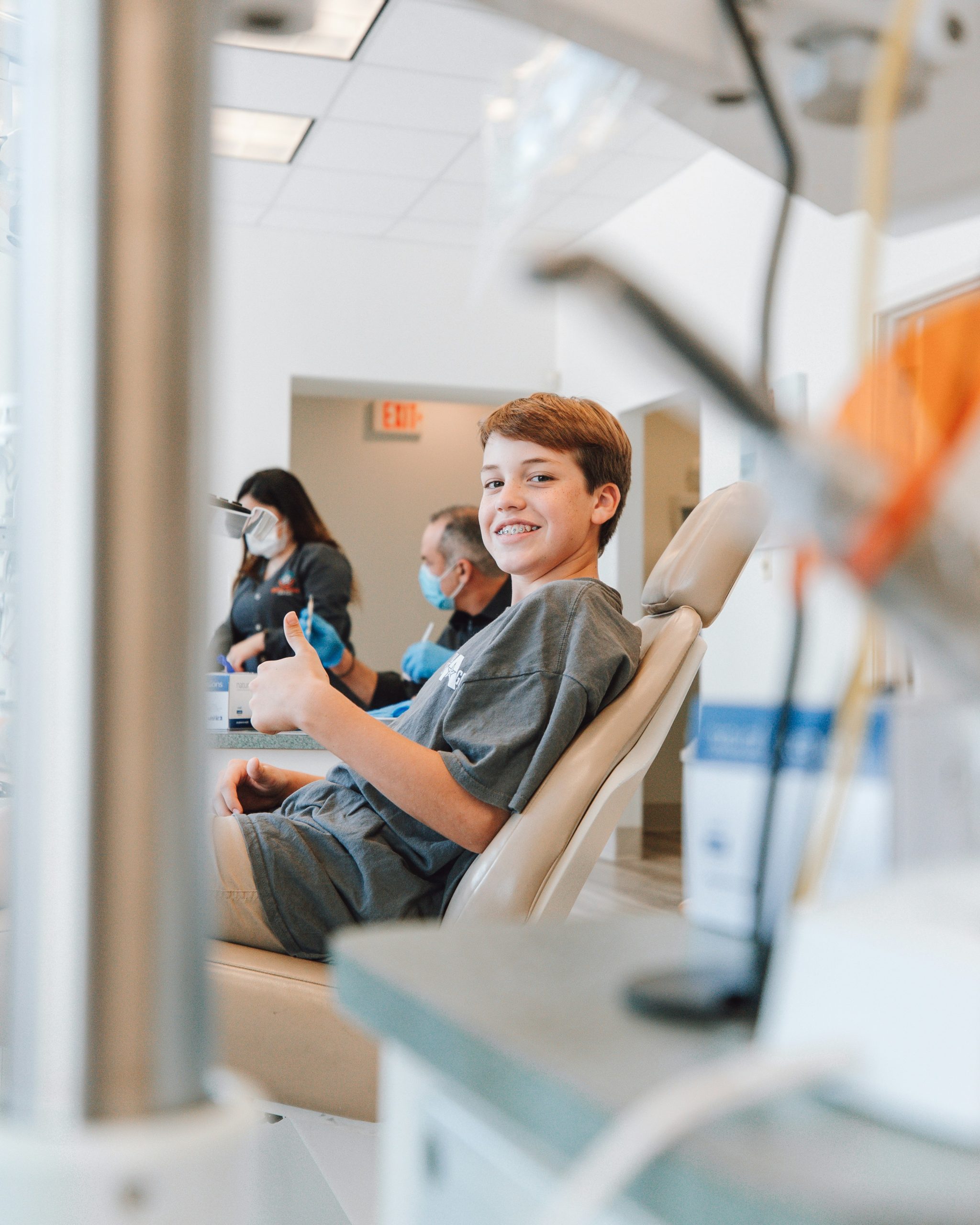 Young boy smiling in the dental chair during a checkup